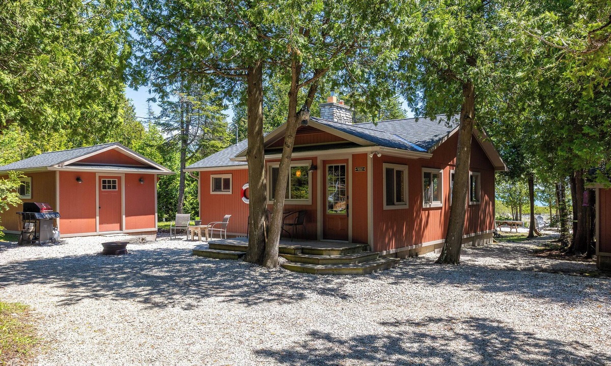 Northern Bruce Peninsula House | Breezy Woods Cottage is a private, cedar-lined escape on Georgian Bay. Enjoy rustic charm, a stone fireplace, stunning forest views, and a peaceful waterfront firepit area—just minutes from Tobermory’s top attractions.