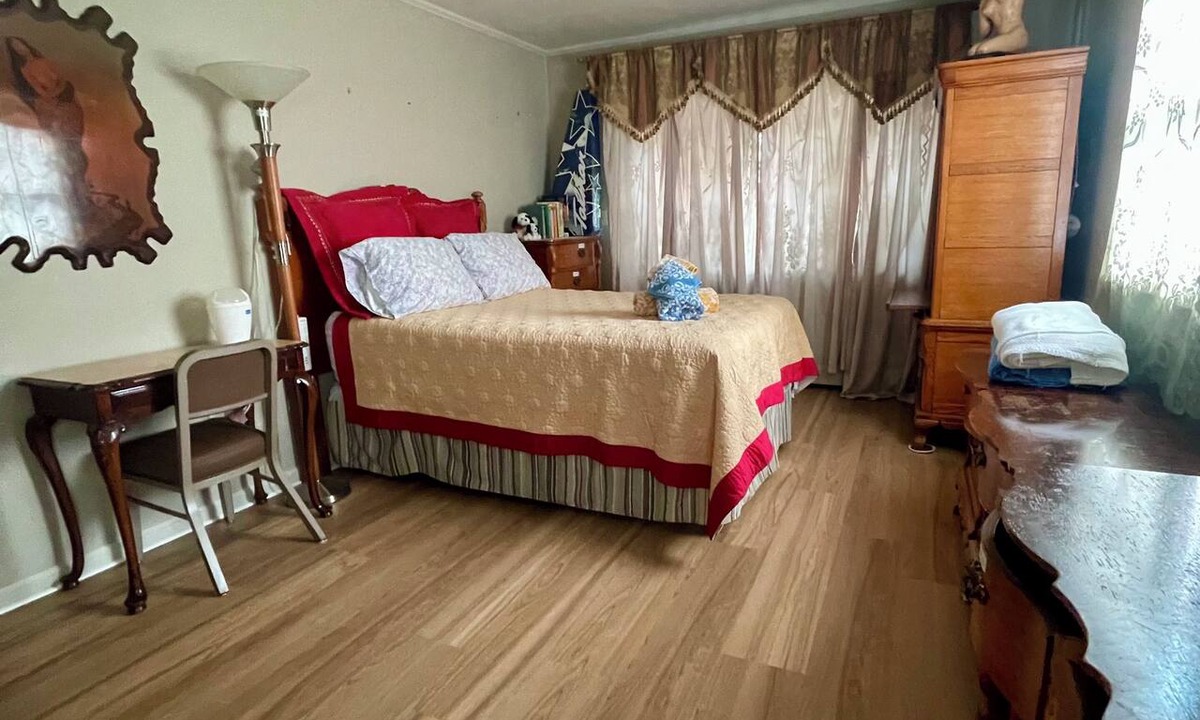 Mitchell House | Comfortable bedroom with adjoining bathroom in Ann Arbor residence