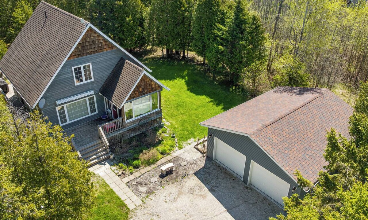 Northern Bruce Peninsula House | Escape to Three Bears Cottage, a cozy cedar-lined cottage just two blocks from Lake Huron. Enjoy evenings by the fireplace, mornings on the wrap-around porch, and peaceful moments surrounded by nature on the beautiful Bruce Peninsula.