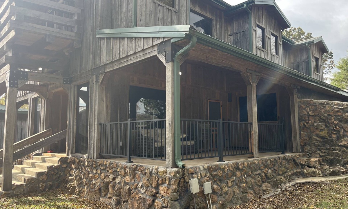 Wyandotte Cabin | Rustic Lodge with a view of open pastures and bison grazing on the land.