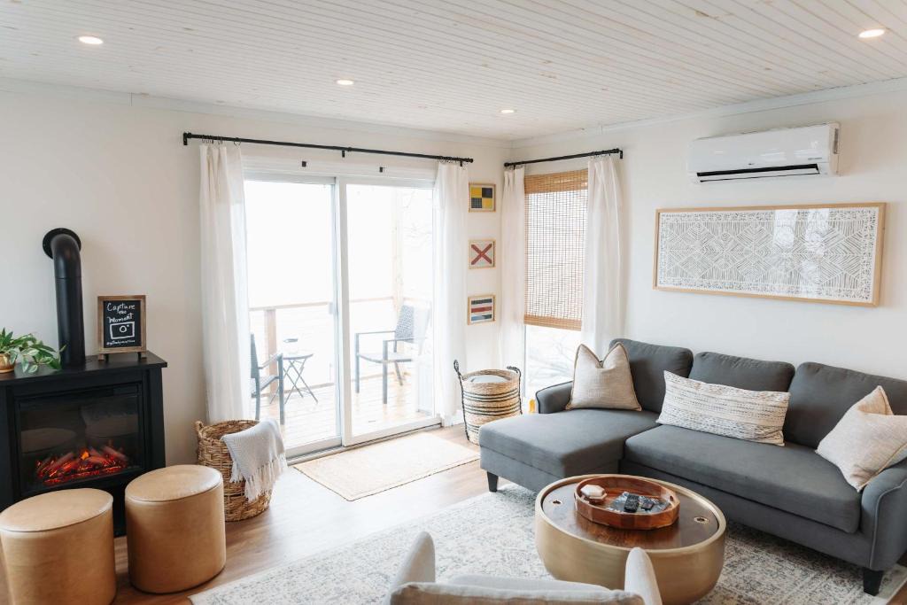 Geneva House | Waters Edge Lakefront with Kayaks Fire Pit and Dock