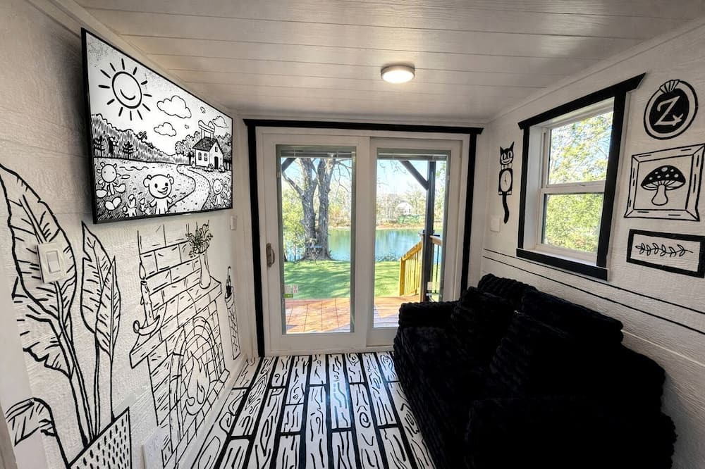 Paige Cabin | Whimsical Lakefront Tiny Home with Hand-Drawn Doodle Design Near Bastrop, Texas
