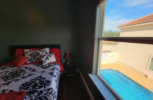 McAllen Apartment | 4 BR Smart Luxe Condo, Gated Community, Pool View, Mins to Costco & Top Golf