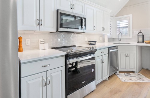 Tool House | Beautiful lakefront views, boat slip, fire pit, grill gazebo, huge family deck
