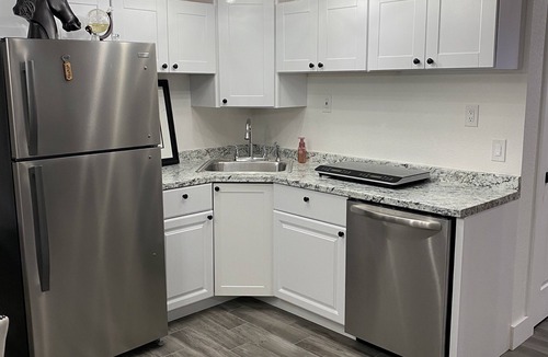 Centennial House | Bright Walk-Out 2BR · Private Patio & Yard · Quiet Area