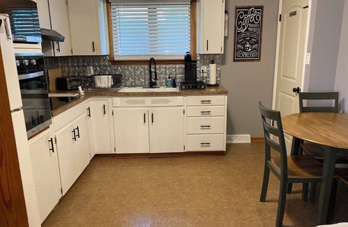Atchison House | Charming 2-bedroom house in Atchison on quiet brick and tree lined street.