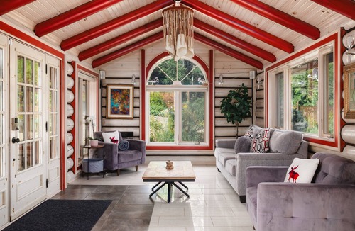 Mandeville Cabin | Charming log cabin nestled in the woods, with a spa and in-ground pool.