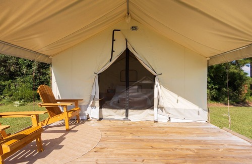 Coldspring RV Rental | Cozy Forest Retreat: Snug Glamping by the Fire Pit