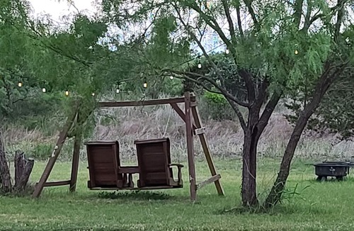 Kempner Cabin | Cozy Tiny Cabin with a small porch and firepit.
