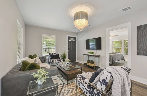 Bryan House | East 27th Bungalow 2 BR, 1 BA, Fully Remodeled, Large Yard and Covered Patio