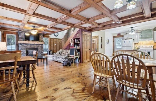 Northern Bruce Peninsula House | Escape to Three Bears Cottage, a cozy cedar-lined cottage just two blocks from Lake Huron. Enjoy evenings by the fireplace, mornings on the wrap-around porch, and peaceful moments surrounded by nature on the beautiful Bruce Peninsula.
