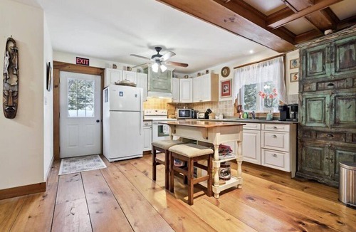 Northern Bruce Peninsula House | Escape to Three Bears Cottage, a cozy cedar-lined cottage just two blocks from Lake Huron. Enjoy evenings by the fireplace, mornings on the wrap-around porch, and peaceful moments surrounded by nature on the beautiful Bruce Peninsula.