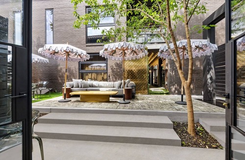 Old East Dallas Condo | Expansive 2-bed loft with fireplace, full kitchen, smart TVs, sofa bed, and access to an award-winning courtyard & resort pool.