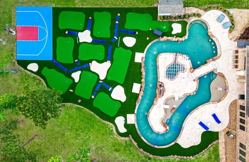 Spring House | Extended-stay paradise: lazy river, theater, poker, Peloton, mini golf and more.