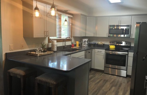 Mount Ida Condo | Forest view, log-sided two bedroom, two bath condo on Lake Ouachita. by RedAwning
