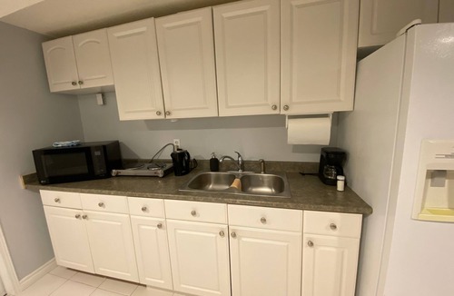 Lisgar Apartment | furnished basement studio, with1 queen bed, a kitchenette, and 1 bathroom.
