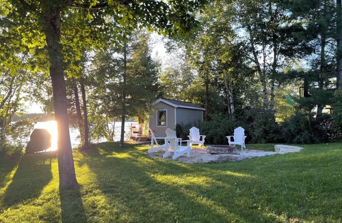 Rideau Lakes Cottage | Glamping anyone? Enjoy picturesque sunsets from your own water’s edge deck!