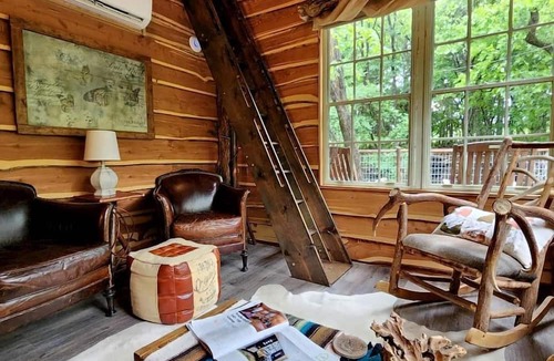 Dennis Cabin | Hobbit Treehouse with Waterfall on the Brazos River for Glamping in Texas