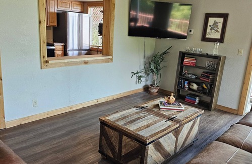 Tia Juana Cabin | Hot tub, boat dock and lakeside with this snug cabin. TINY BEDROOMS