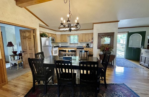 Mount Ida Cottage | Lake view three bedroom, three bath log-sided cottage with private hot tub overlooking Lake Ouachita. by RedAwning