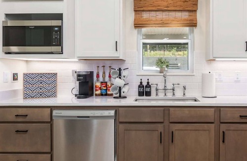 Mid America House | Lakefront Condo with Pool, Fire Pit, and Boat Slip