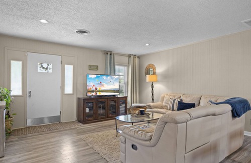 Silver Creek Village House | Lakefront Cottage with Private Dock, Wood-Burning Fireplace and Sunroom