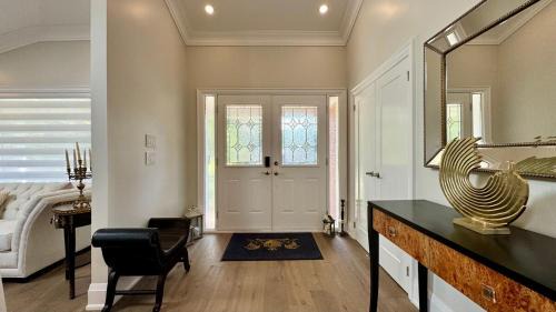 Clarkson-Lorne Park House | Luxury 4BR Retreat with Pool, Piano, Spa & Games