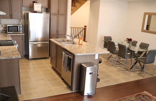 Markham House | Markham home near Toronto with dual patios, bright