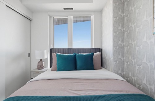 The Queensway Apartment | Modern 2BR Retreat with Private Balcony & Parking