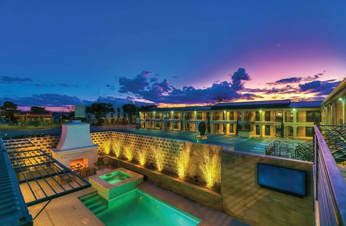 San Angelo Hotel | Modern King Room with Plush Bedding – Perfect for Business or Leisure Stays!
