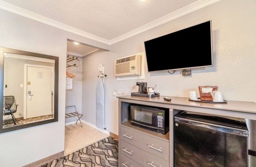 Ira Hotel | Near Sammy Baugh Golf Course & Local Dining Spots | Queen Bed Non‑Smoking