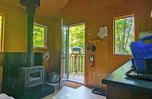 Saint-Faustin-Lac-Carre House | Perched treehouse with a tree growing through the deck | Lodging #08
