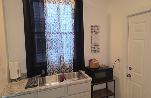 Topeka Apartment | Relaxing Downtown 1 Bed, Dog Friendly Apartment with Deck, Dog Exercise Area