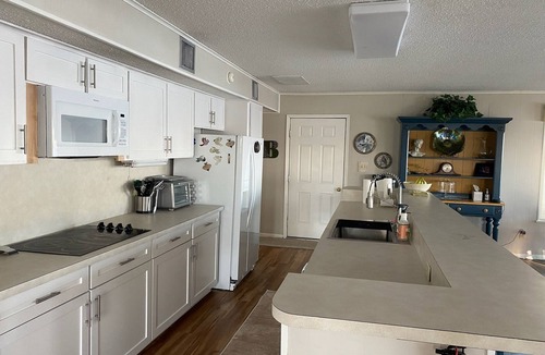 Trinity House | Romantic Lakefront Retreat: Hot Tub, Private Deck, Screened Porch, Dock & Kayaks