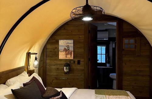 Pinnacles Entrance Badlands House | Rustic Covered Glamping Wagons with Modern Comforts Near Wall Drug – Wall, South Dakota