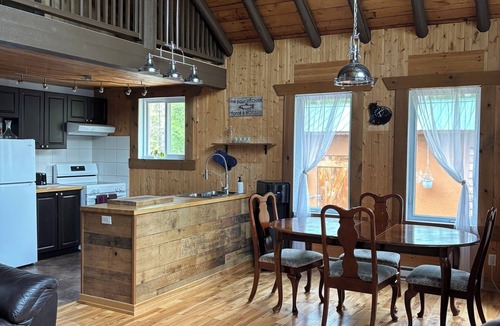 Sainte-Anne-du-Lac Ski Chalet | Rustic lakeside cottage.