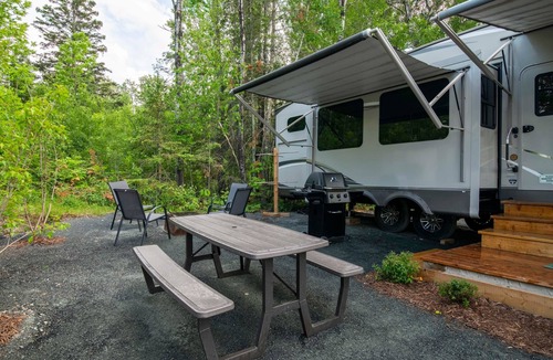 Kenora House | RV 5 Rustic Charm w/Queen Bed with Forest Background