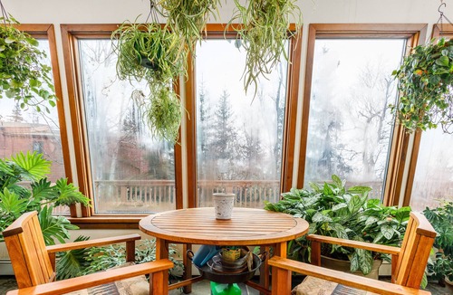 Rabbit Creek House | Secluded retreat with lush sunroom, scenic deck, fireplace & W/D
