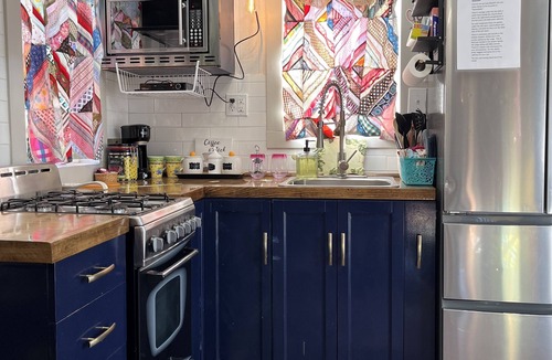 Sweetwater House | “SERENDIPITY” a boho inspired tiny home on wheels in country setting