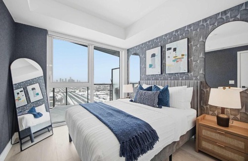 The Queensway Apartment | Sleek 2BR Condo with Balcony & Skyline Views