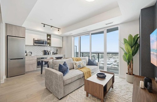 The Queensway Apartment | Sleek 2BR Condo with Balcony & Skyline Views
