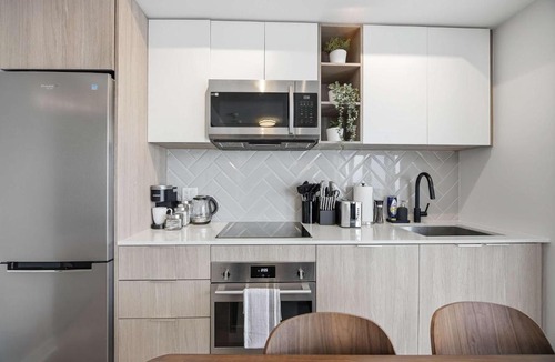 The Queensway Apartment | Sleek 2BR Condo with Balcony & Skyline Views