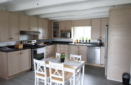 Clarington House | Spacious 5-bedroom farmhouse in charming Kendal, surrounded by farmlands.