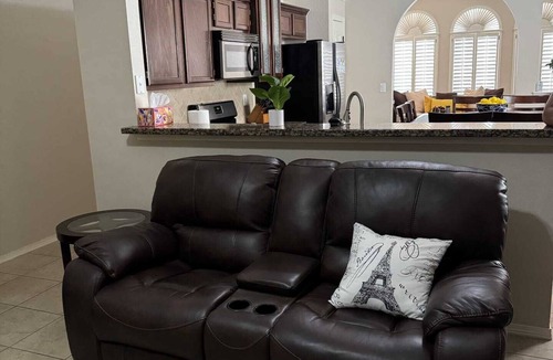 Biggs Field House | Spacious & comfortable home perfect for groups or remote workers! Features 2 living rooms, a dedicated office nook, and a fully stocked kitchen. Relax in the private, sunny backyard.