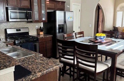 Biggs Field House | Spacious & comfortable home perfect for groups or remote workers! Features 2 living rooms, a dedicated office nook, and a fully stocked kitchen. Relax in the private, sunny backyard.