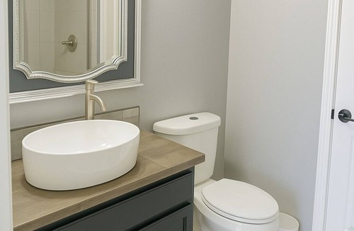 Timberlane House | Spacious comfortable King room. Work-friendly. High-speed internet w/50" TVs
