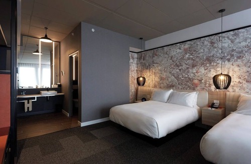 Brossard Hotel | Spacious Room Ideal for Families Near Kid-Friendly Attractions & Dining Options
