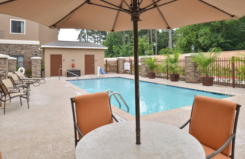 Tomball Apartment | Studio Suite in Tomball | Shared Outdoor Pool + 24h Fitness Center