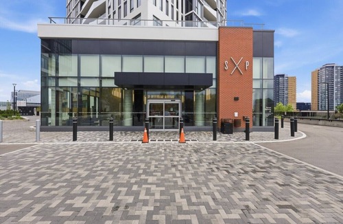 Kitchener Apartment | Stylish 2BR in Station Park | Private Patio + Spa, Gym & Bowling