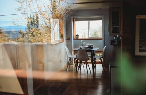 Fairbanks Ski Chalet | This A-frame is surrounded by mountain ranges that you can enjoy from the many windows